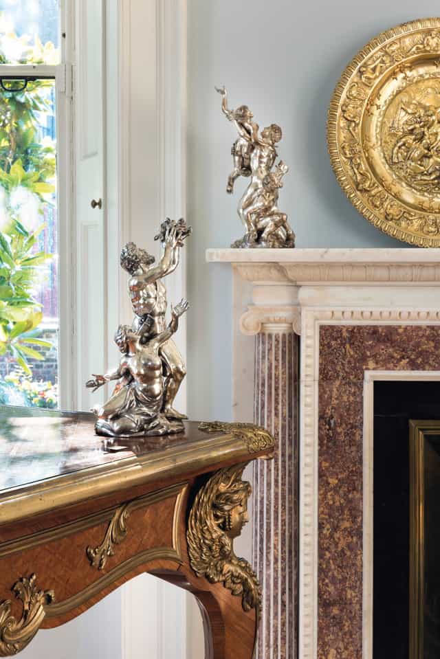 Elegant Georgian Eating Room with striking sculpture for upscale events and gatherings.