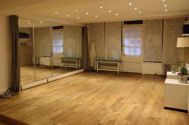Versatile event space with natural light, ideal for workshops and fitness classes.