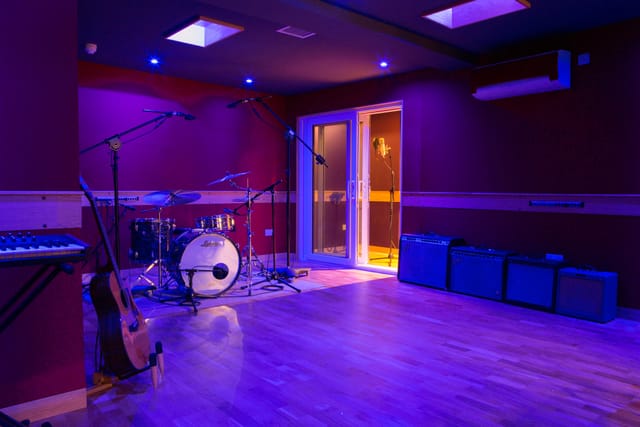 Vibrant Dock Street Studio venue with stage, ideal for music events and workshops.