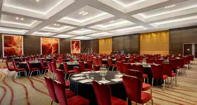 Elegant Park Plaza ballroom event, conference seating, red accents.