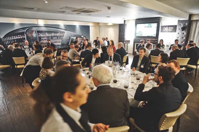 Boardroom at Selhurst Park Stadium for corporate dinner event with round-table setup.