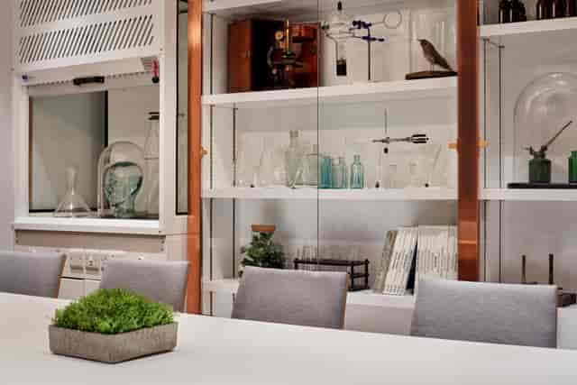 Modern meeting space at Holmes Hotel London with sleek table and scientific decor.