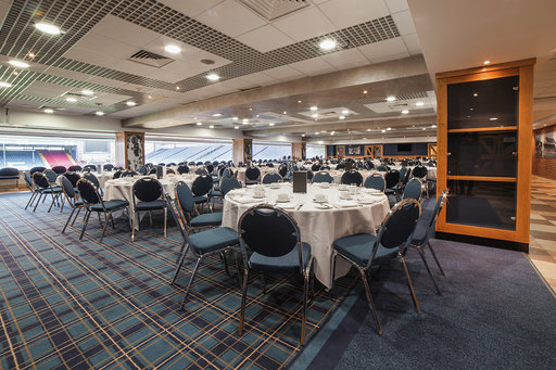 Jacks Lounge at Ewood Experience, spacious venue with round tables for corporate events.