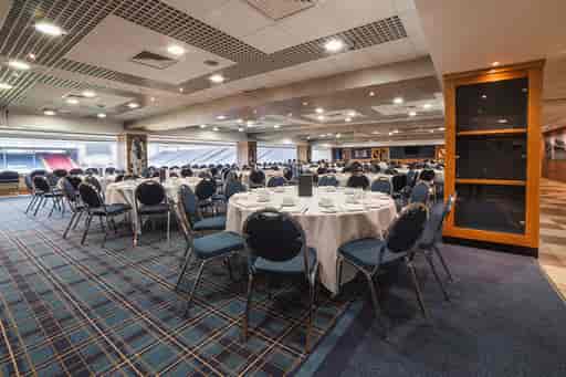 Jacks Lounge at Ewood Experience, spacious venue with round tables for corporate events.