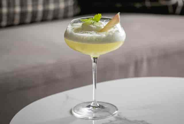 Elegant cocktail in glassware at The Laboratory, Holmes Hotel London - event beverage menu.