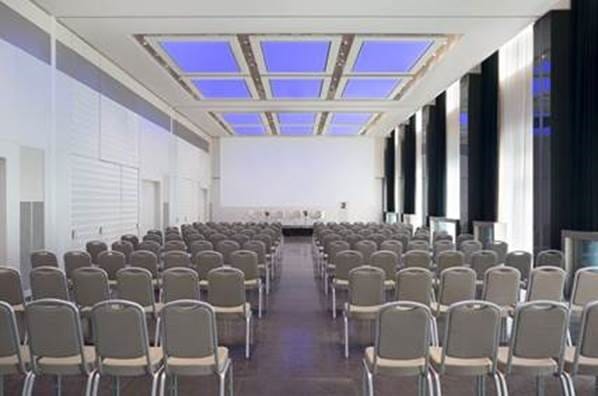 Spacious conference room at Excelsior Hotel Gallia for corporate events and workshops.