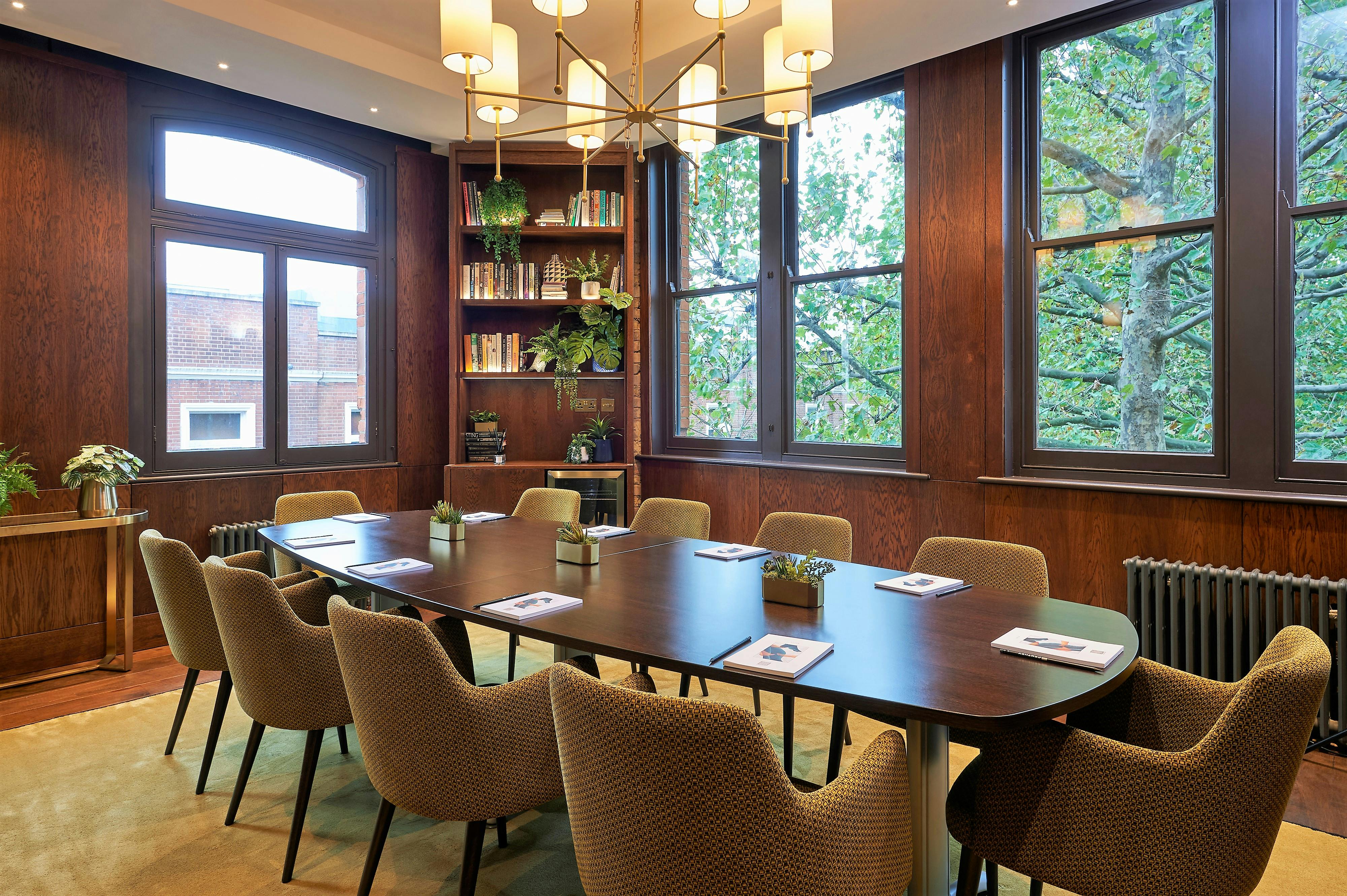 Meeting room at The Broadwick, featuring warm wood tones for collaborative workshops.