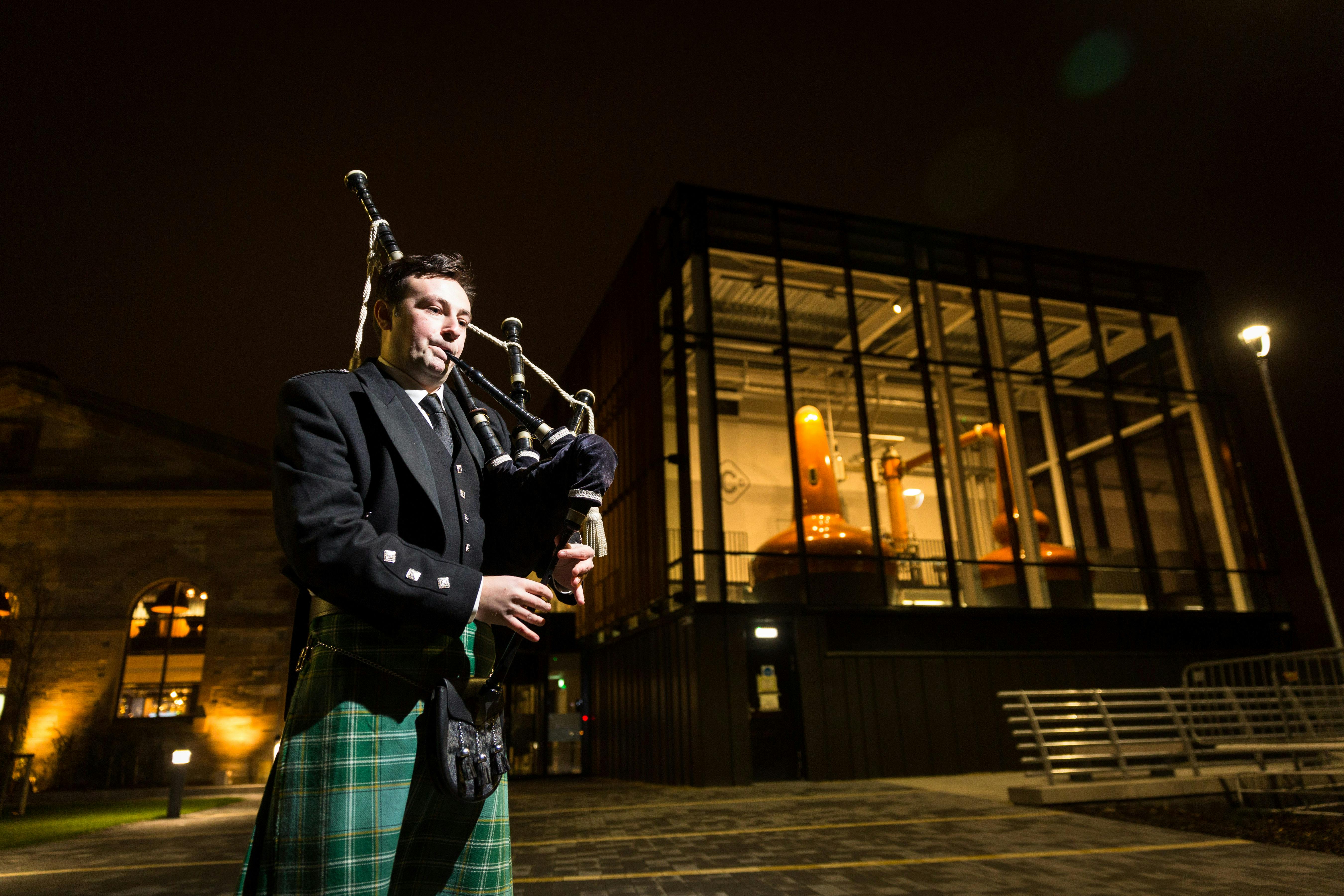 Piper in traditional attire at The Clydeside Distillery for cultural events.