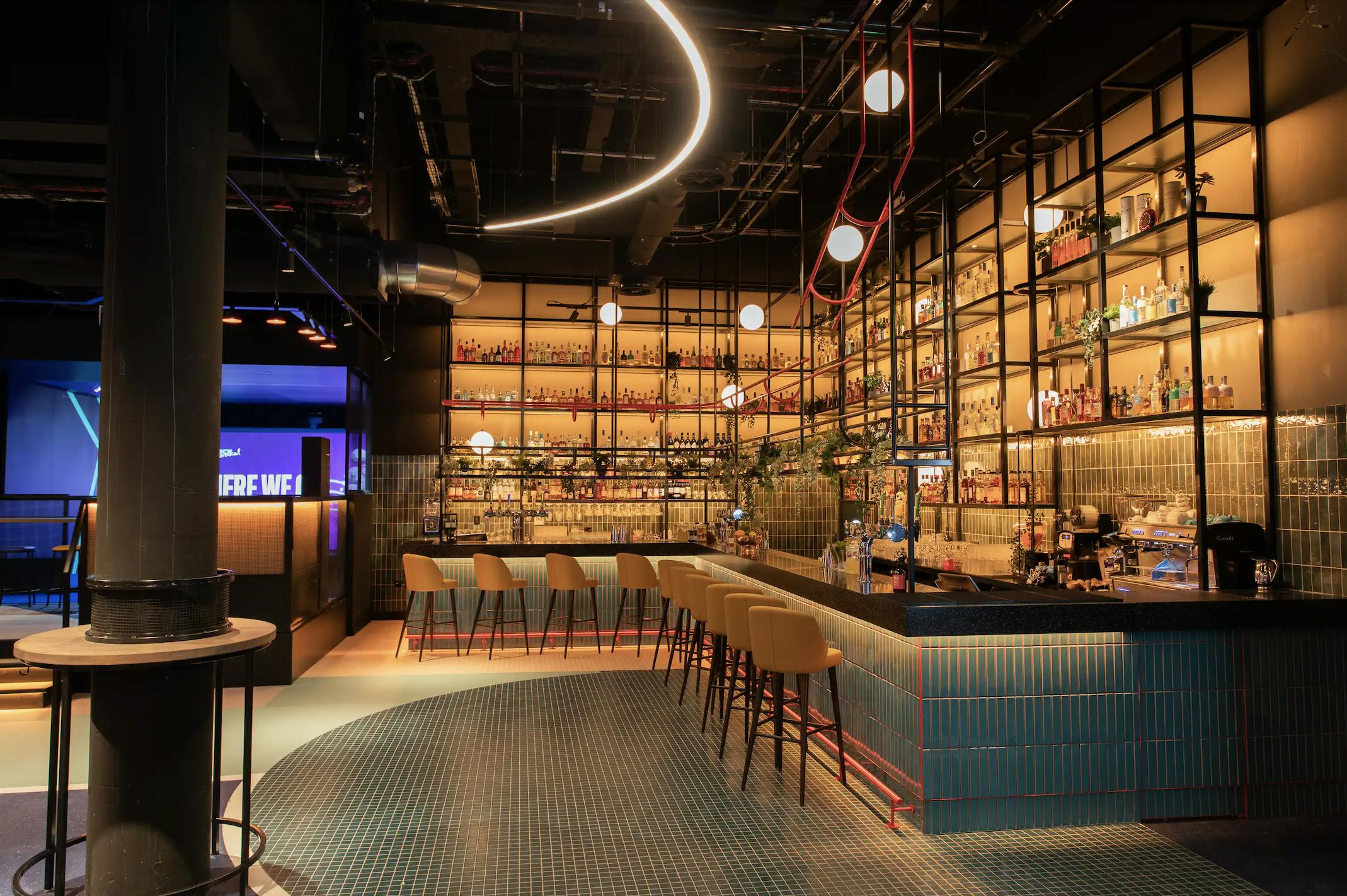 Modern bar venue with stylish lighting for networking events and gatherings.