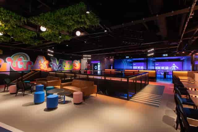 Modern event space at TOCA Social with vibrant art, ideal for networking and presentations.