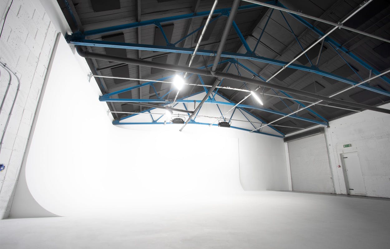 Versatile event space in Klatch Studio with expansive white backdrop for product launches.