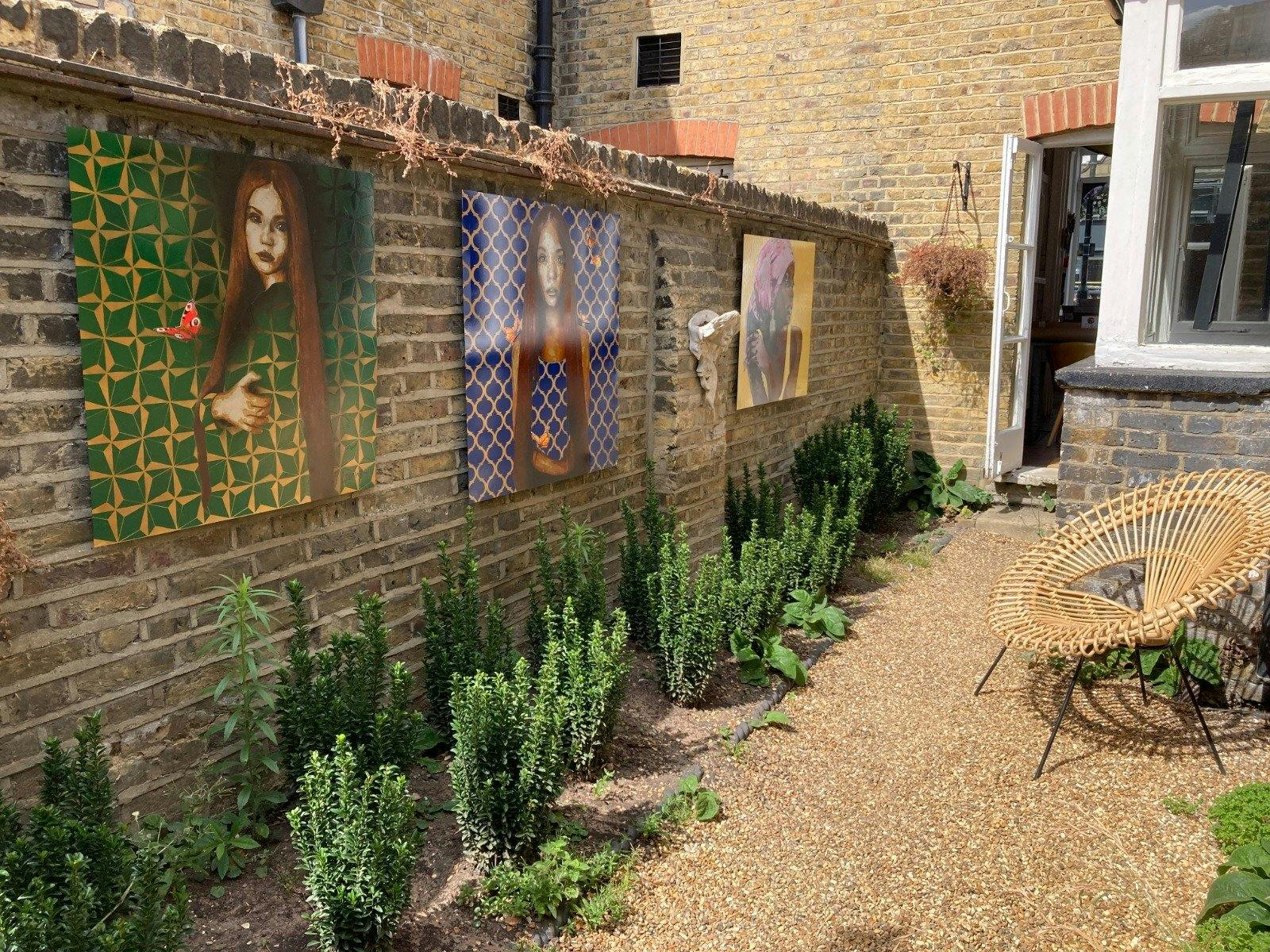 Charming outdoor garden gallery with vibrant art, perfect for events and workshops.