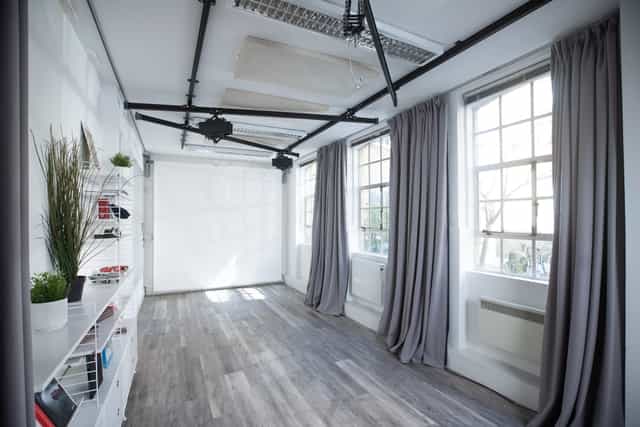 Versatile FOMO Studios event space with natural light for meetings and workshops.
