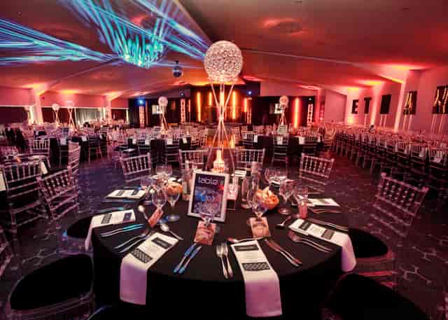 The Hive London gala setup with ghost chairs and atmospheric lighting for luxury event venue hire.