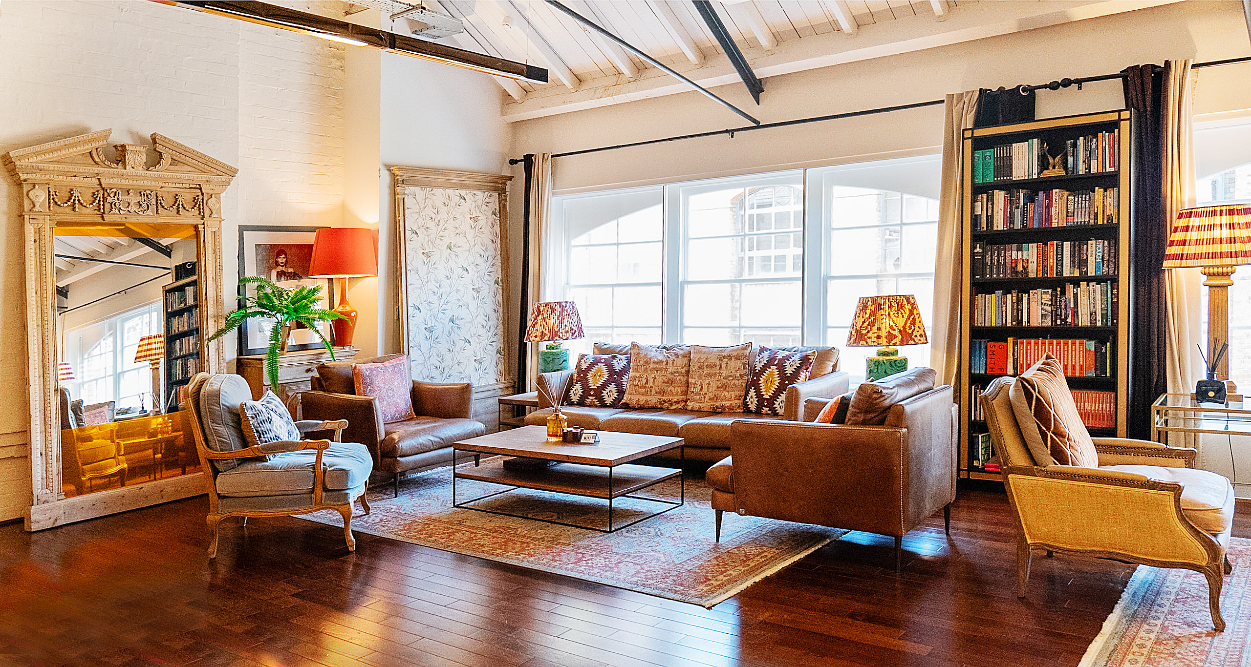 Cozy lounge at The Chalet, warm lighting for meetings and collaboration. - Banner