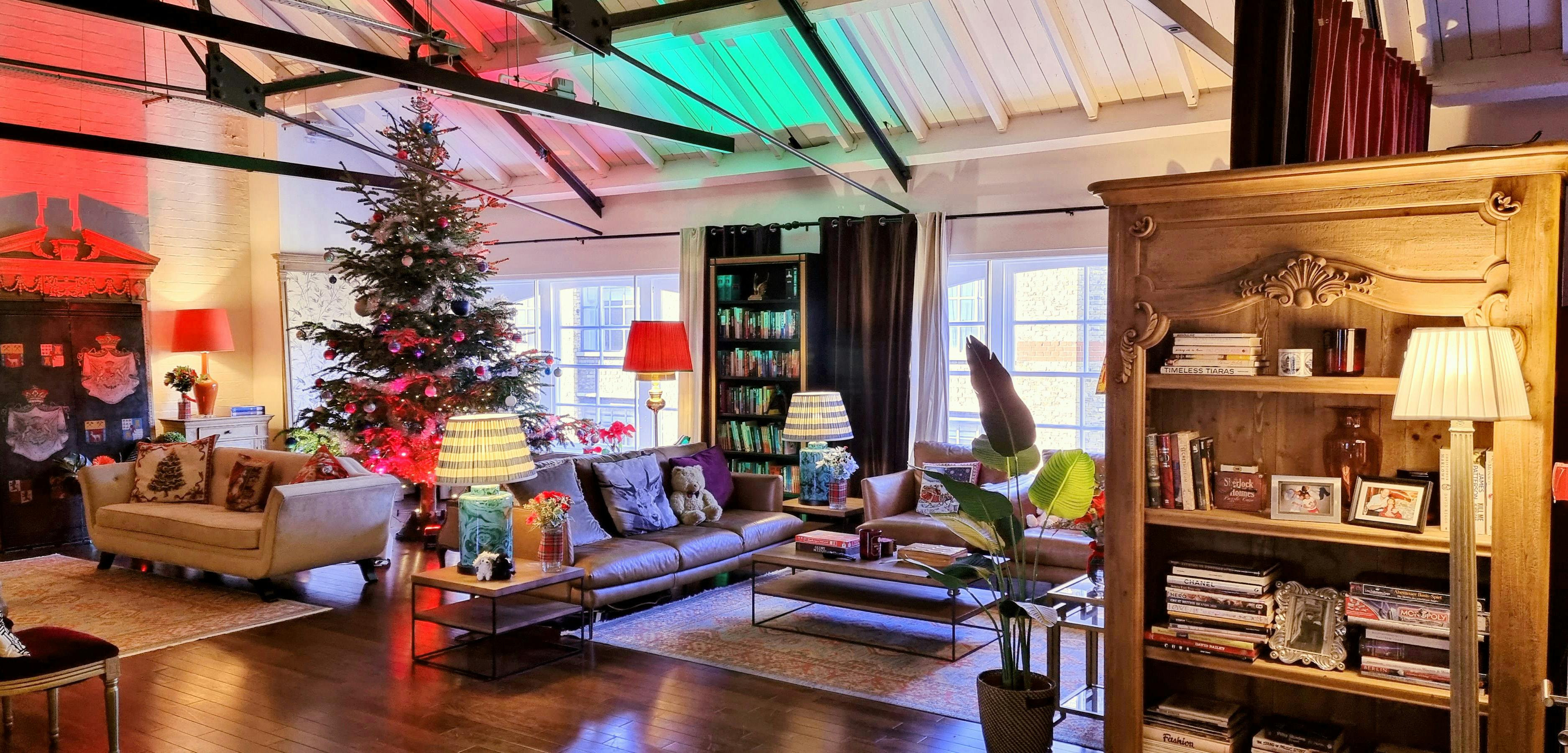 Cozy event space at The Chalet with festive Christmas tree for intimate gatherings.