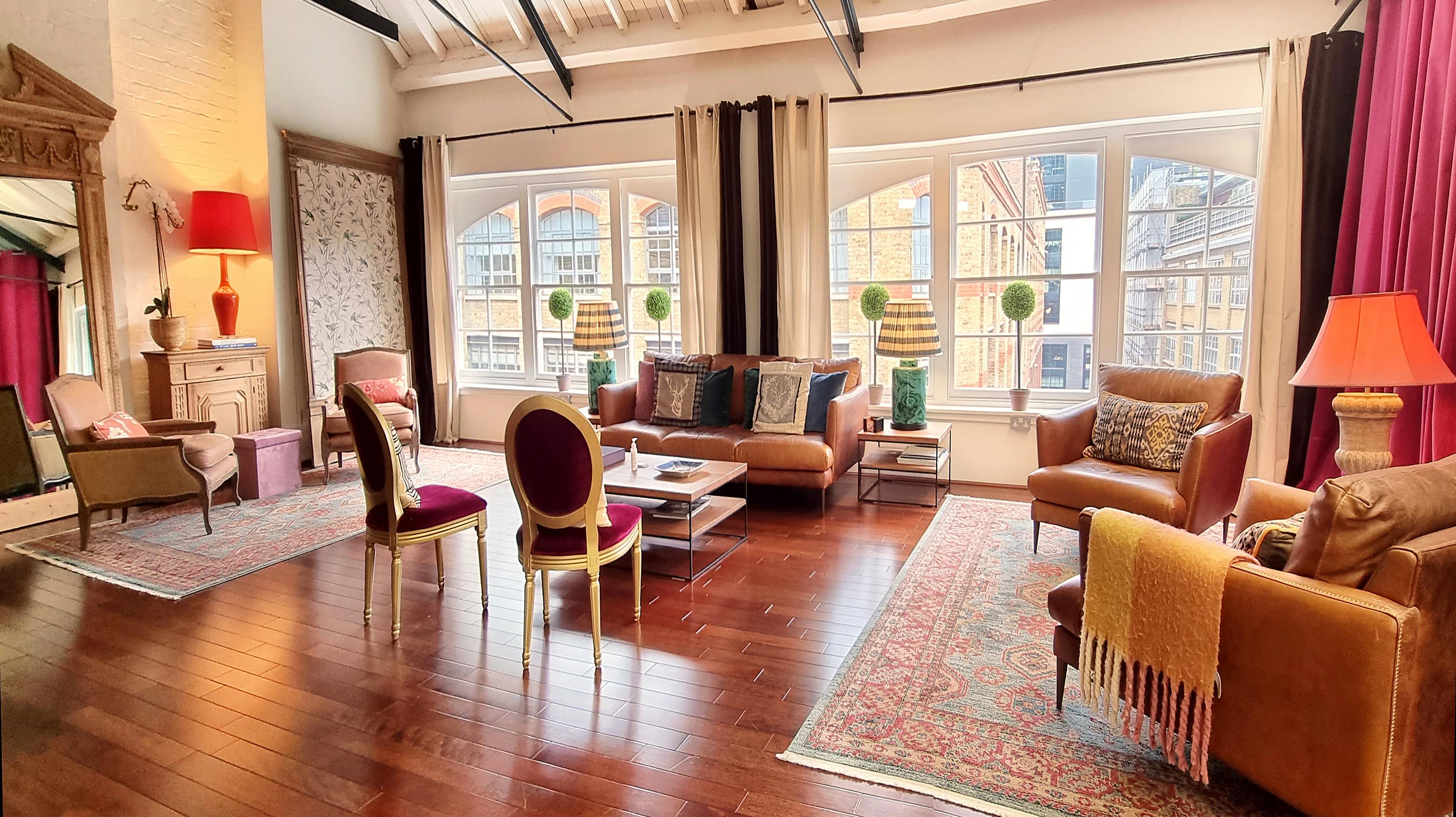 Stylish meeting space at The Chalet, featuring warm colors and natural light for events.