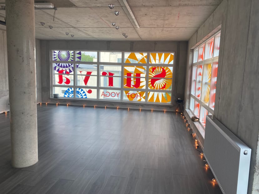 Bright Surya Studio 2 with large windows, perfect for yoga sessions and workshops.