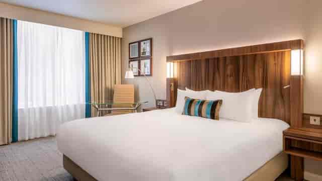 Modern hotel room in Courtyard by Marriott Edinburgh, ideal for business events and conferences.