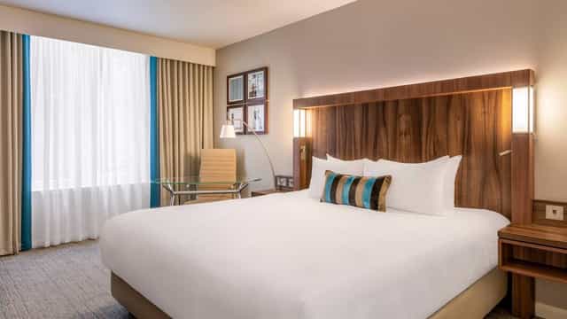 Modern hotel room in Courtyard by Marriott Edinburgh, ideal for business events and conferences.