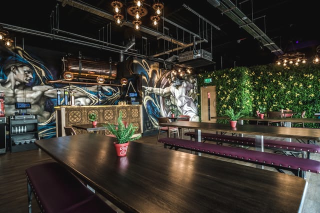 Vibrant industrial-chic event space in Dough Dough Liverpool for creative meetings and gatherings.