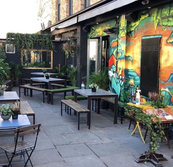 Vibrant outdoor venue in Islington with colorful mural for casual meetings and events.