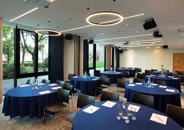Royal Suite meeting space with navy blue linens for workshops and seminars.