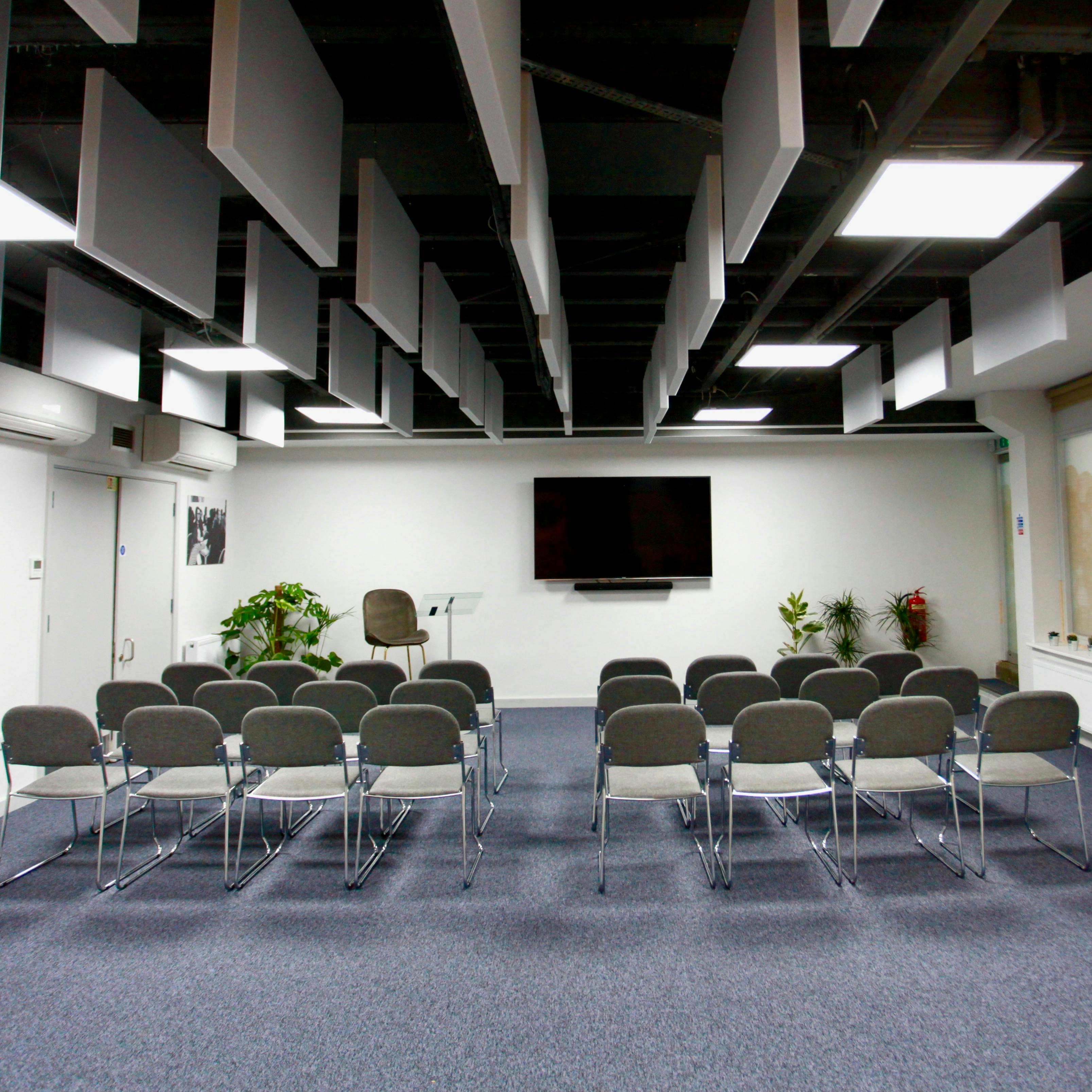 Meeting space at Neal Street Espresso with chairs for engaging presentations and workshops.