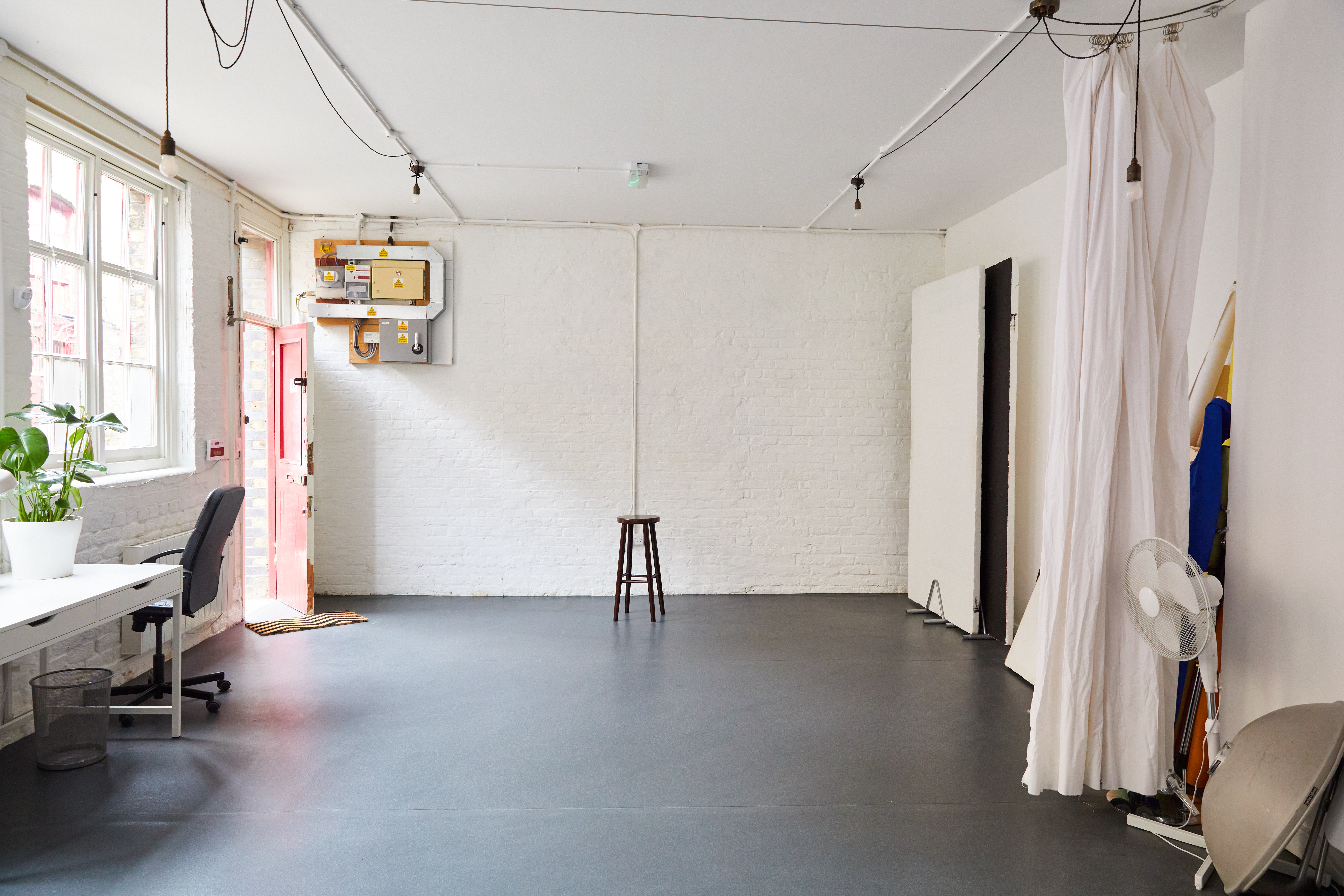 Versatile minimalist event space at Bright Banana Studios for workshops and gatherings. - Banner