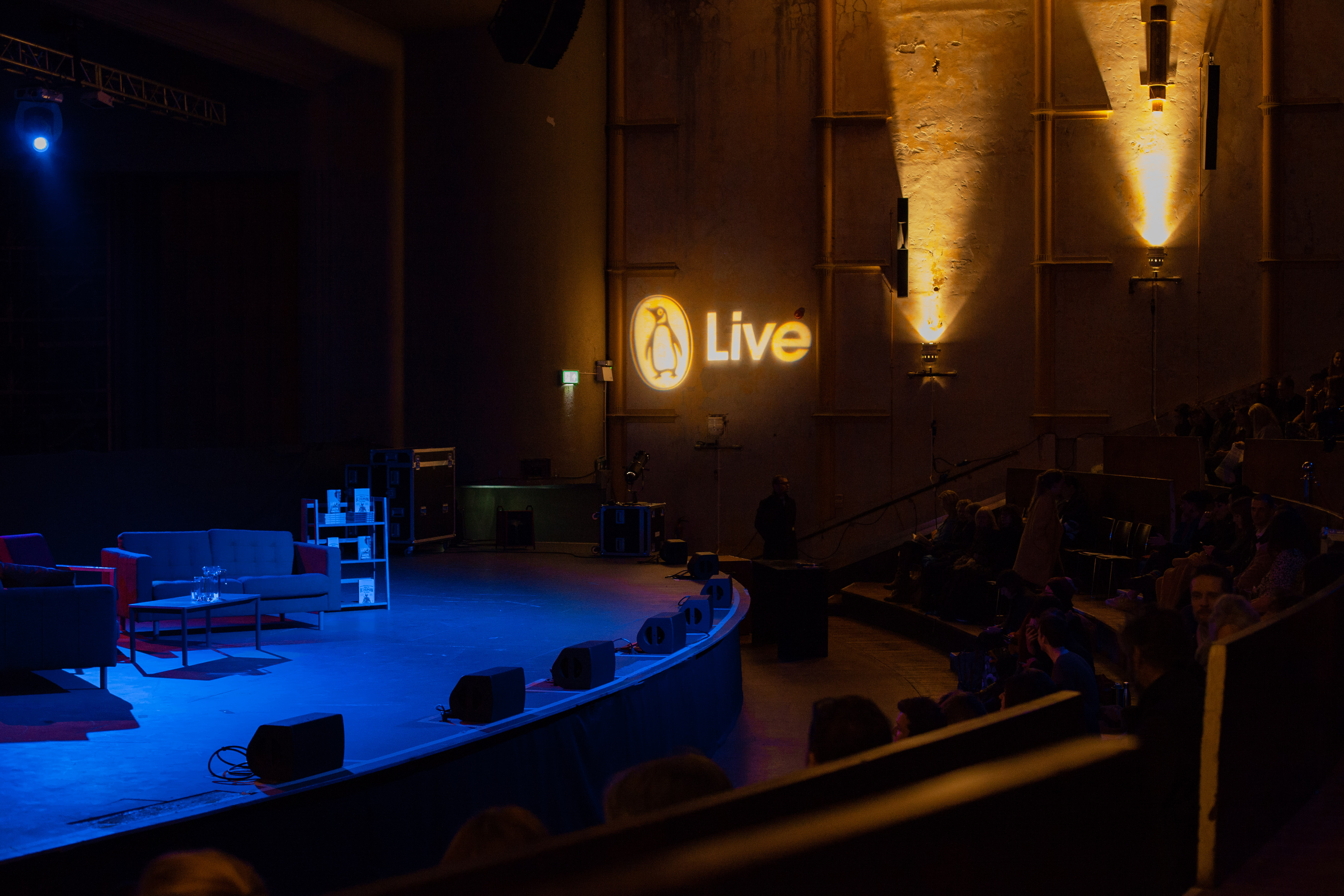 Theatre in EartH stage set for live presentation with inviting lighting and seating.