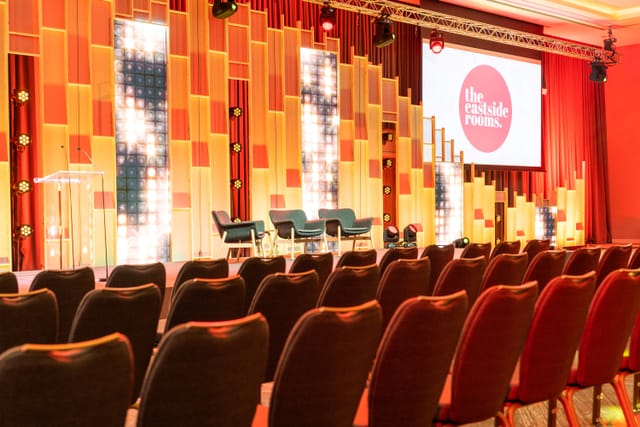 Modern event space Affinity Two with vibrant lighting, perfect for conferences and discussions.