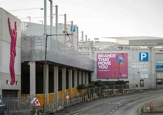 Pink Coach Park in Wembley, vibrant urban venue for events with bold signage.