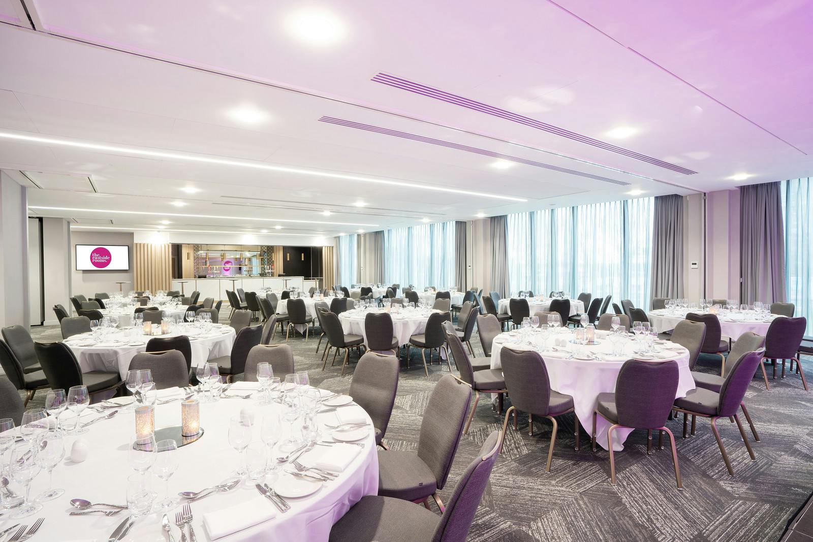 Belmont Two event space with elegant tables, ideal for corporate dinners and celebrations.