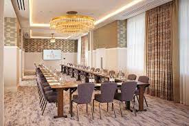 Manhattan Suite meeting room at The Biltmore Mayfair, elegant table for corporate events. - Banner