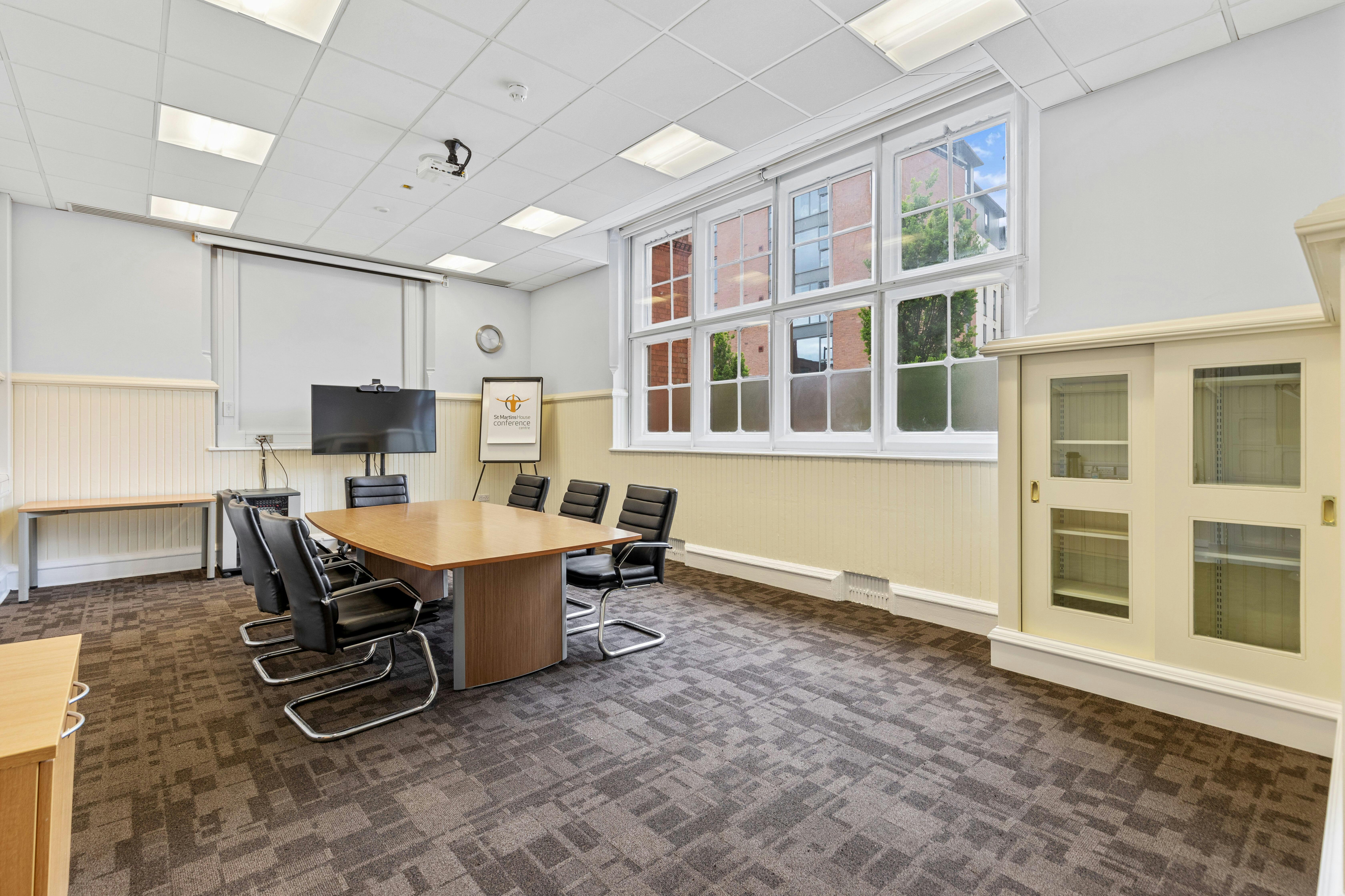 Heyrick Room at St Martins House: bright meeting space with large conference table.