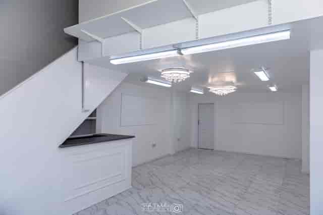 Modern event space with elegant chandeliers for corporate meetings and social gatherings.