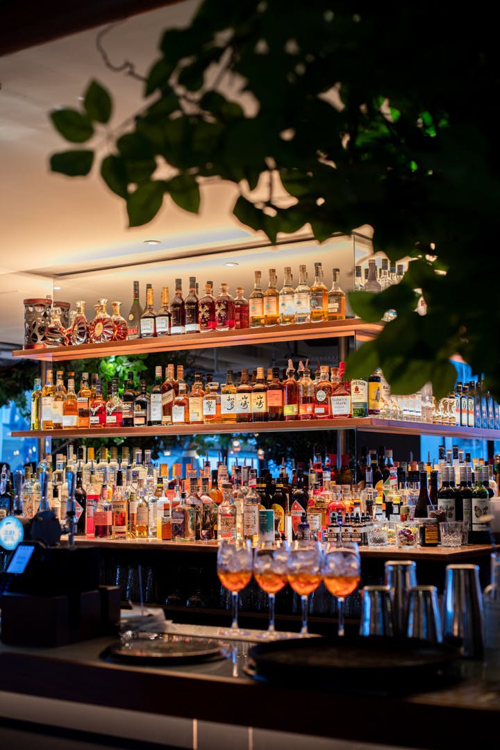 Well-stocked bar at Billingsgate, Pergola on the Wharf for elegant events and cocktails.