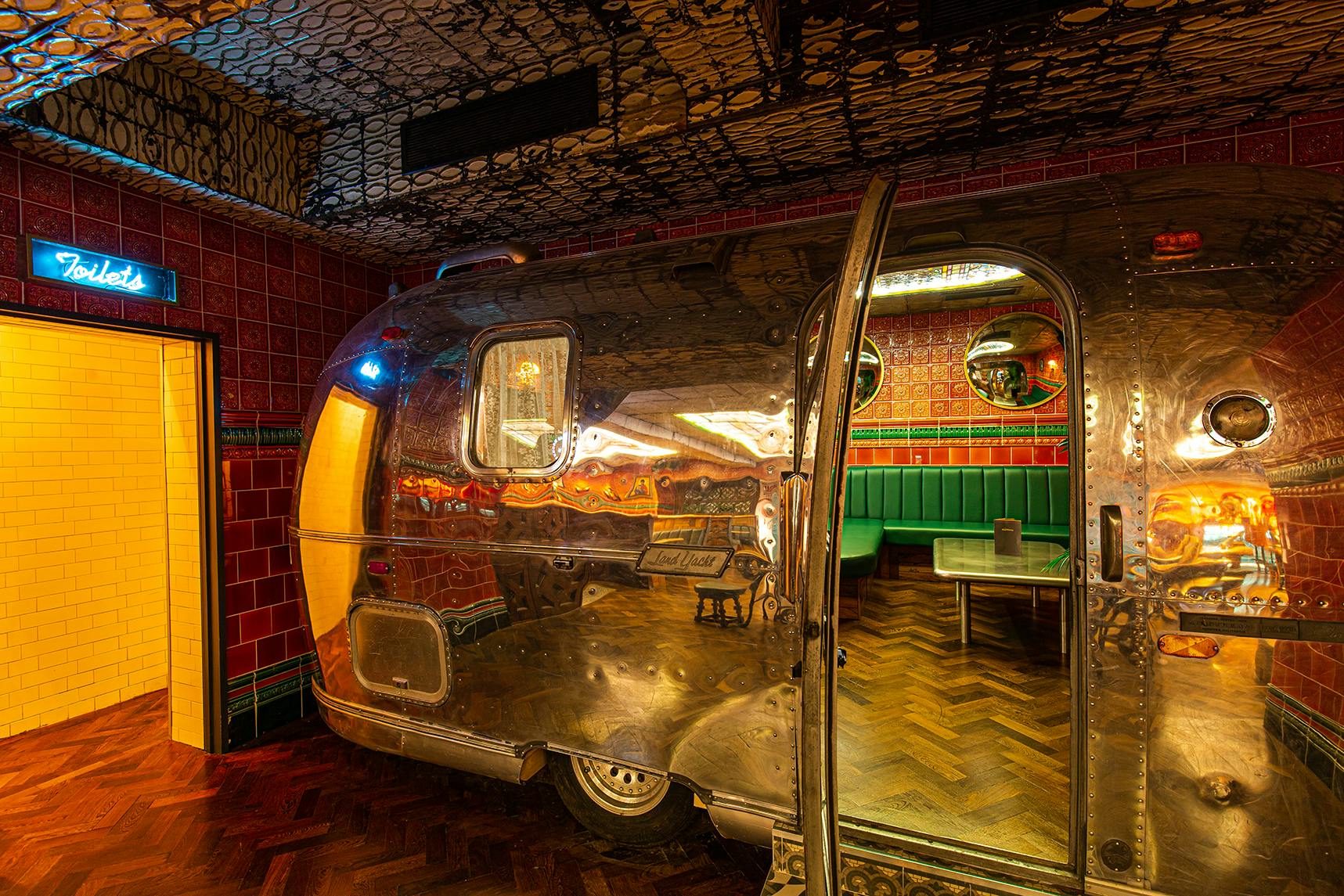 Airstream caravan event space in The Blues Kitchen, Manchester, perfect for creative gatherings.