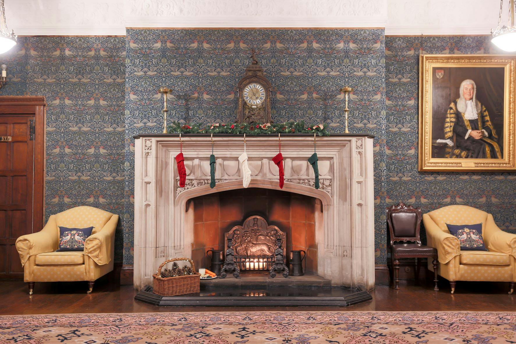 Cozy Christmas meeting space with elegant fireplace at Ironmongers' Hall.