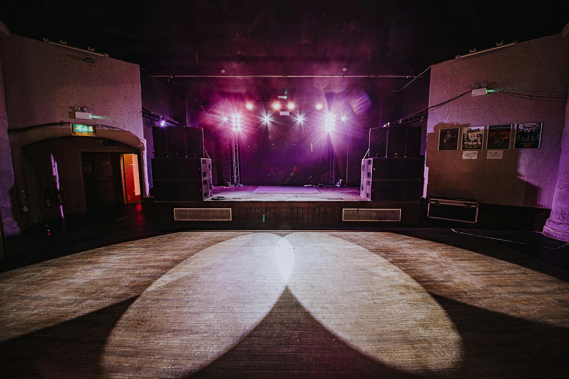 Main room at The Globe Cardiff with vibrant stage lighting for events and concerts.