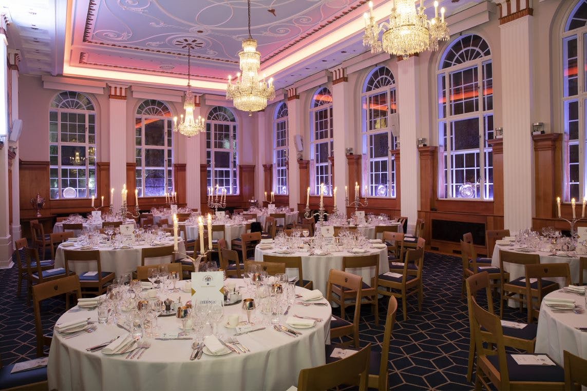 Elegant banquet hall with round tables, ideal for weddings and corporate events.