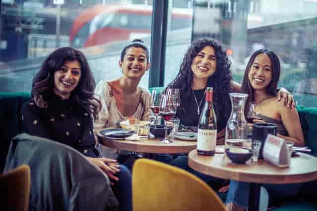 Vibrant gathering of women dining at Vagabond Shoreditch, perfect for networking events.