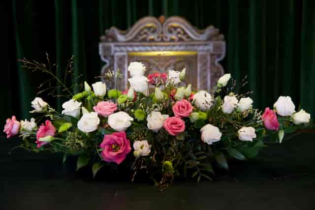 Floral centerpiece on a skirted head table for a Conway Hall conference or formal event.