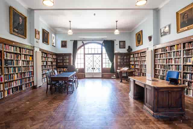 Spacious Conway Hall library with wooden bookshelves, perfect for events and seminars.