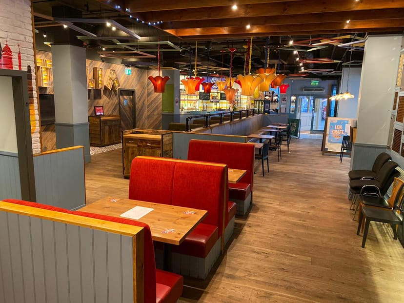 Modern LDN Craft bar with cozy booths, ideal for casual meetings and small events.