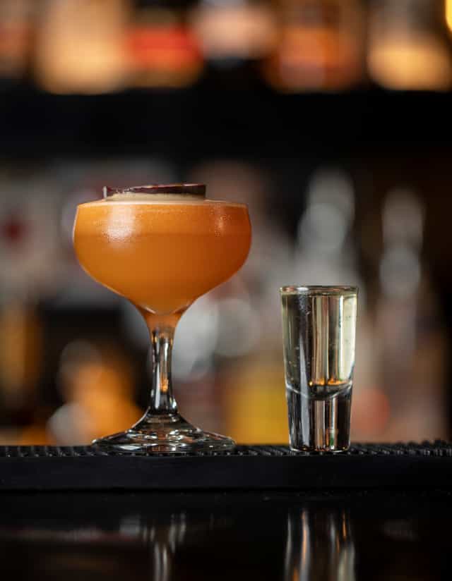 Elegant cocktail and shot glass at Notting Hill Arts Club, perfect for networking events.