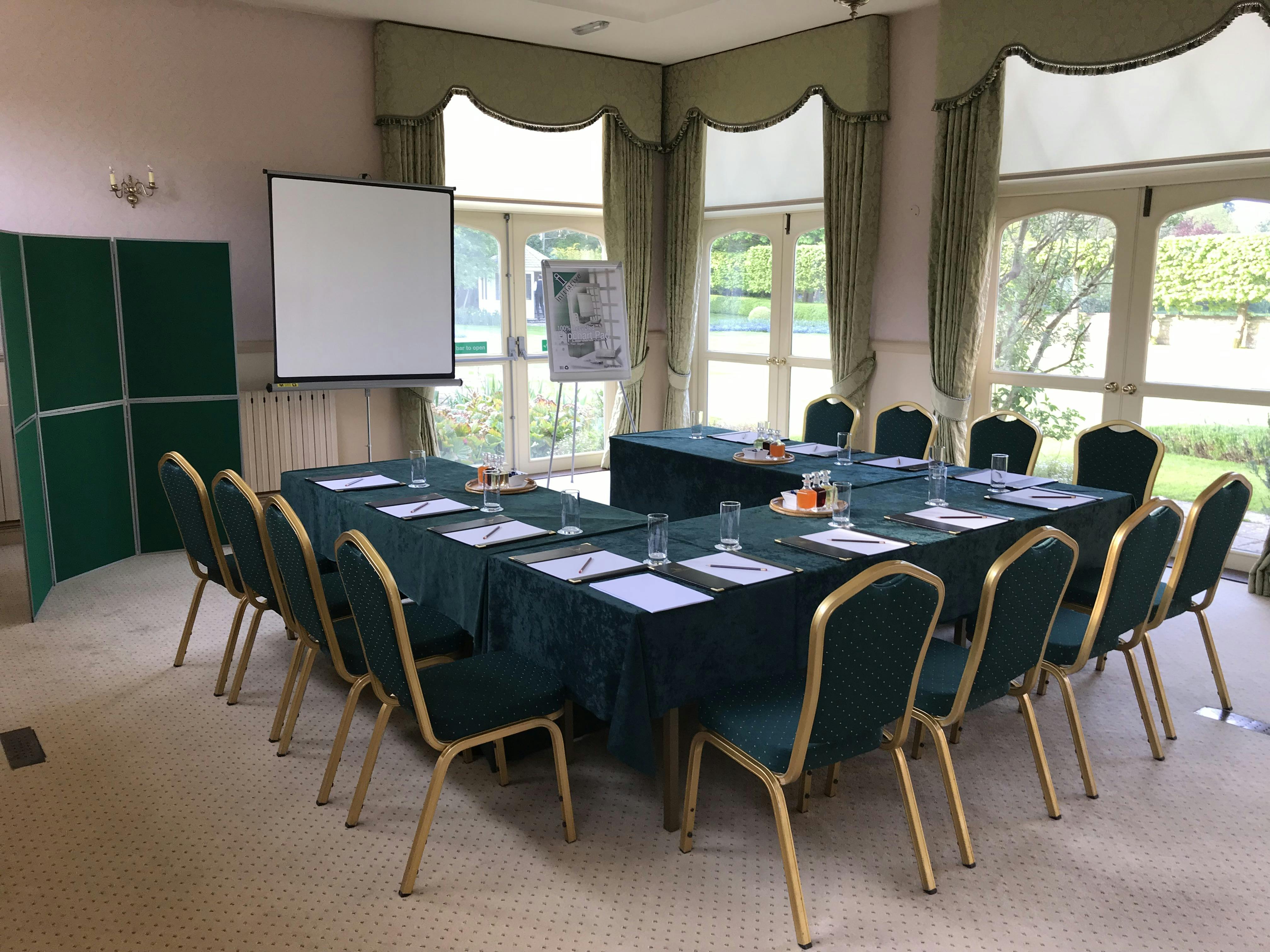 The Garden Room at Horsted Place Hotel, elegant meeting space with natural light.
