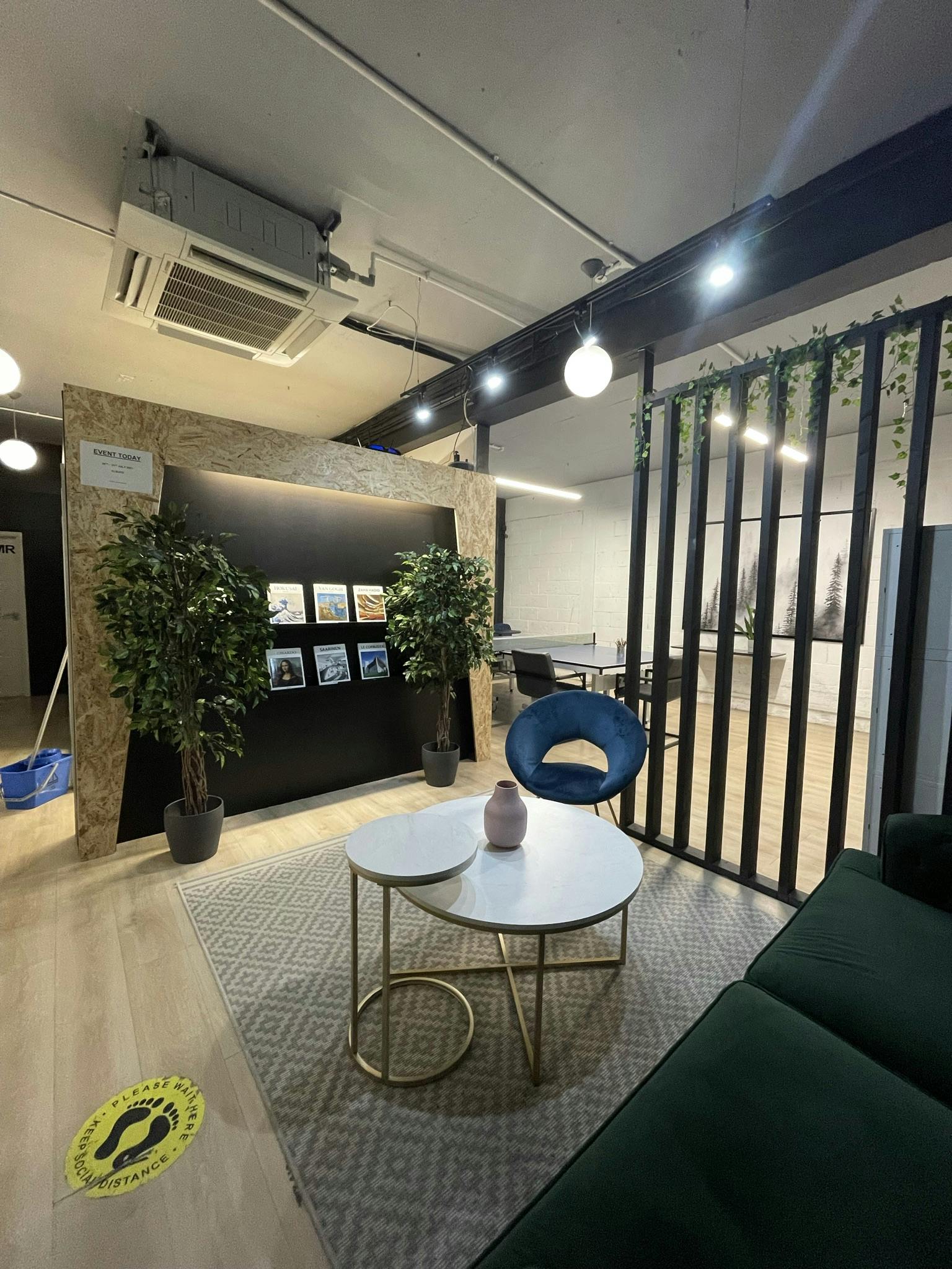 Modern event space in Liberty Workspace with greenery, ideal for meetings and gatherings.