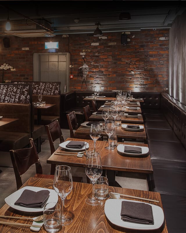Stylish Jinjuu Event Space with elegant tables for intimate gatherings and corporate dinners.