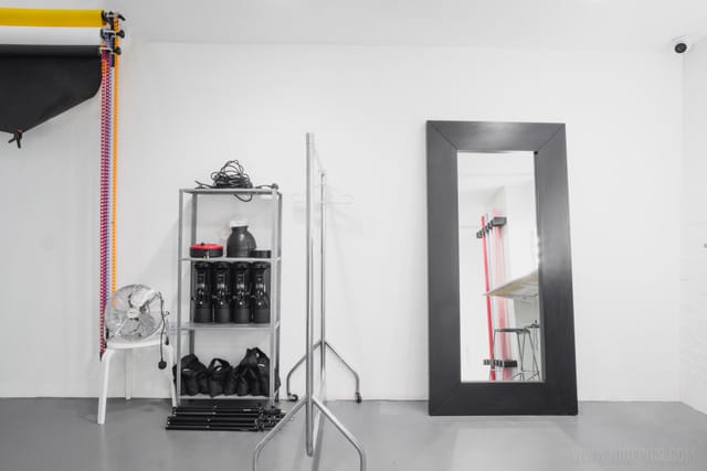 Minimalist studio setup at Ctrl Creative Camden for meetings and events, featuring a full-length mirror.